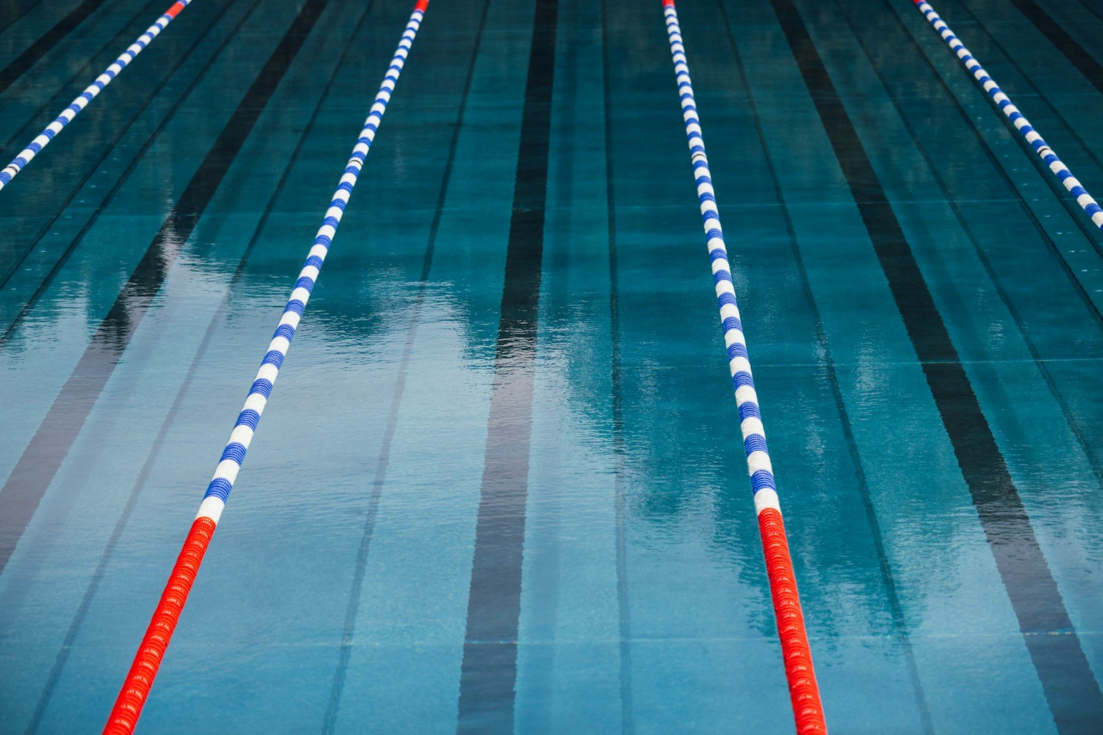a row of blue and white striped swimming lanes